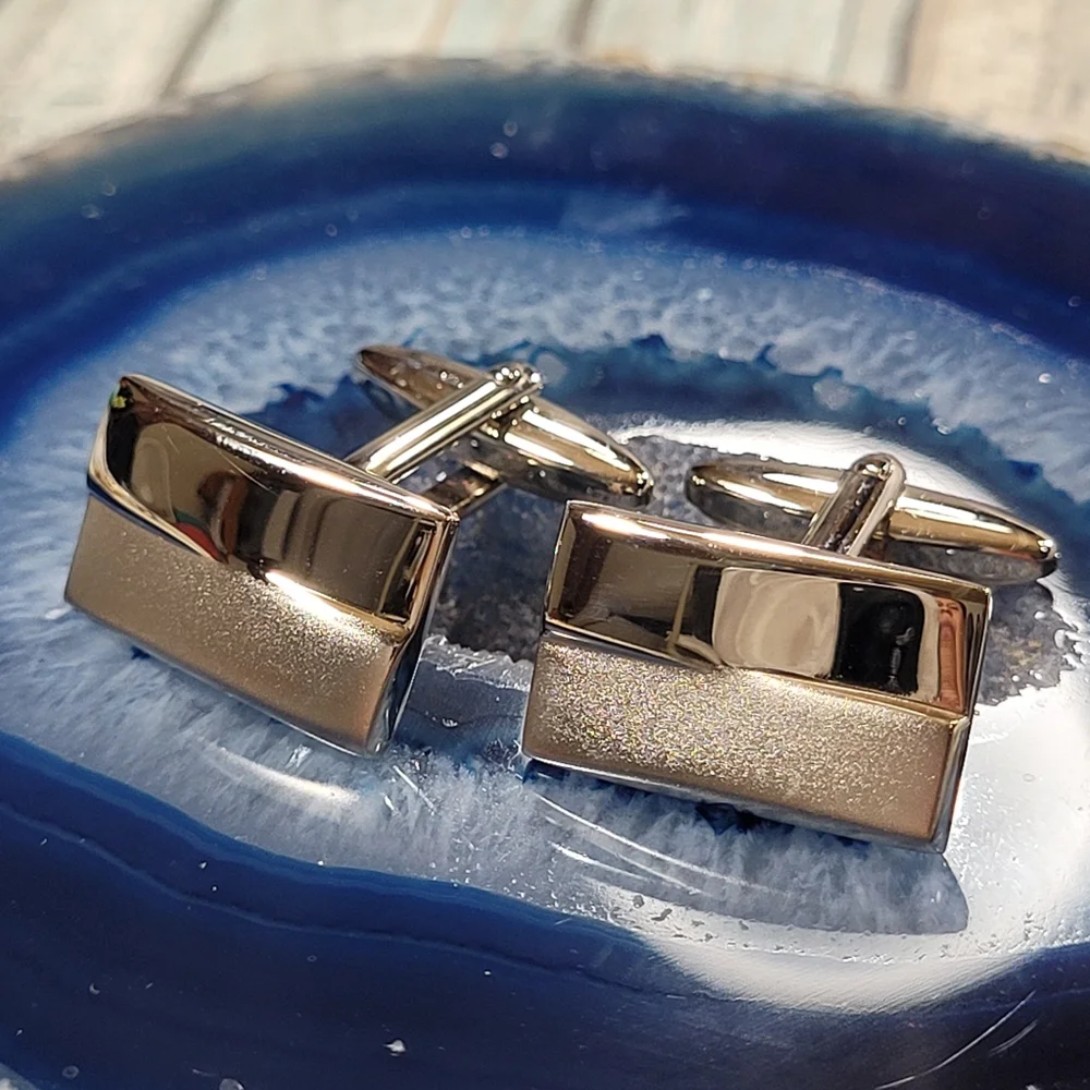 Cuff Links and Tie clip.